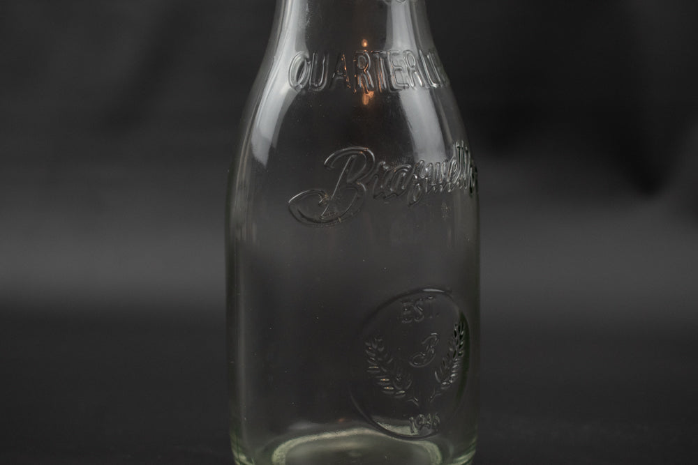 Braswell's 1946 Quarter Liter Clear Glass vintage Milk Bottle with Reusable Snap on